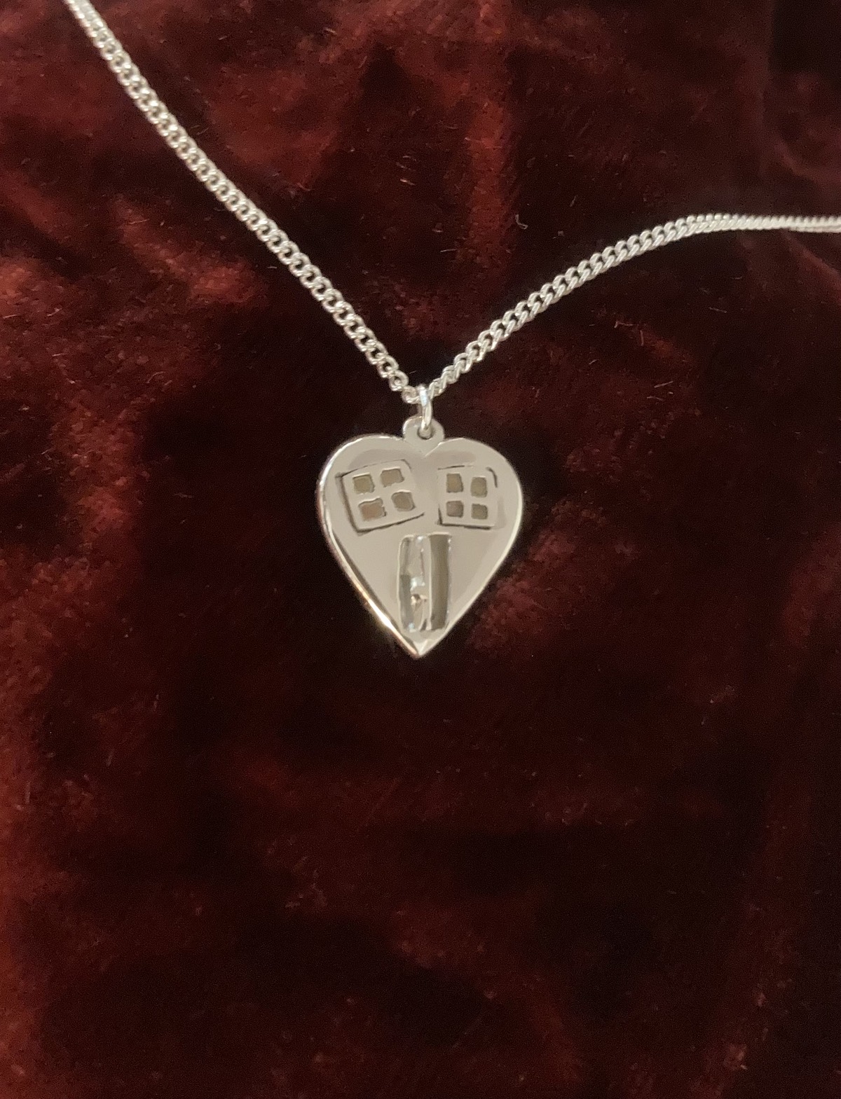 Silver heart with windows and an open door  pendant