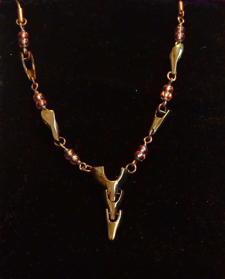 Hand formed necklace of brass links, glass beads, with snake chain