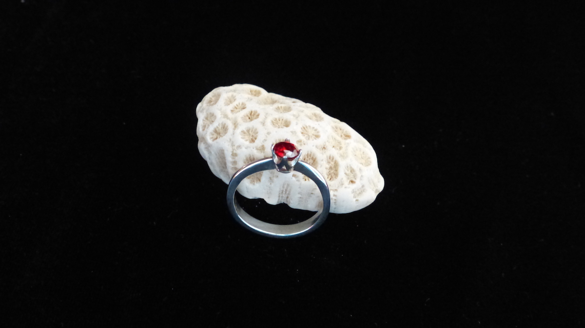 Silver ruby red ring high angle