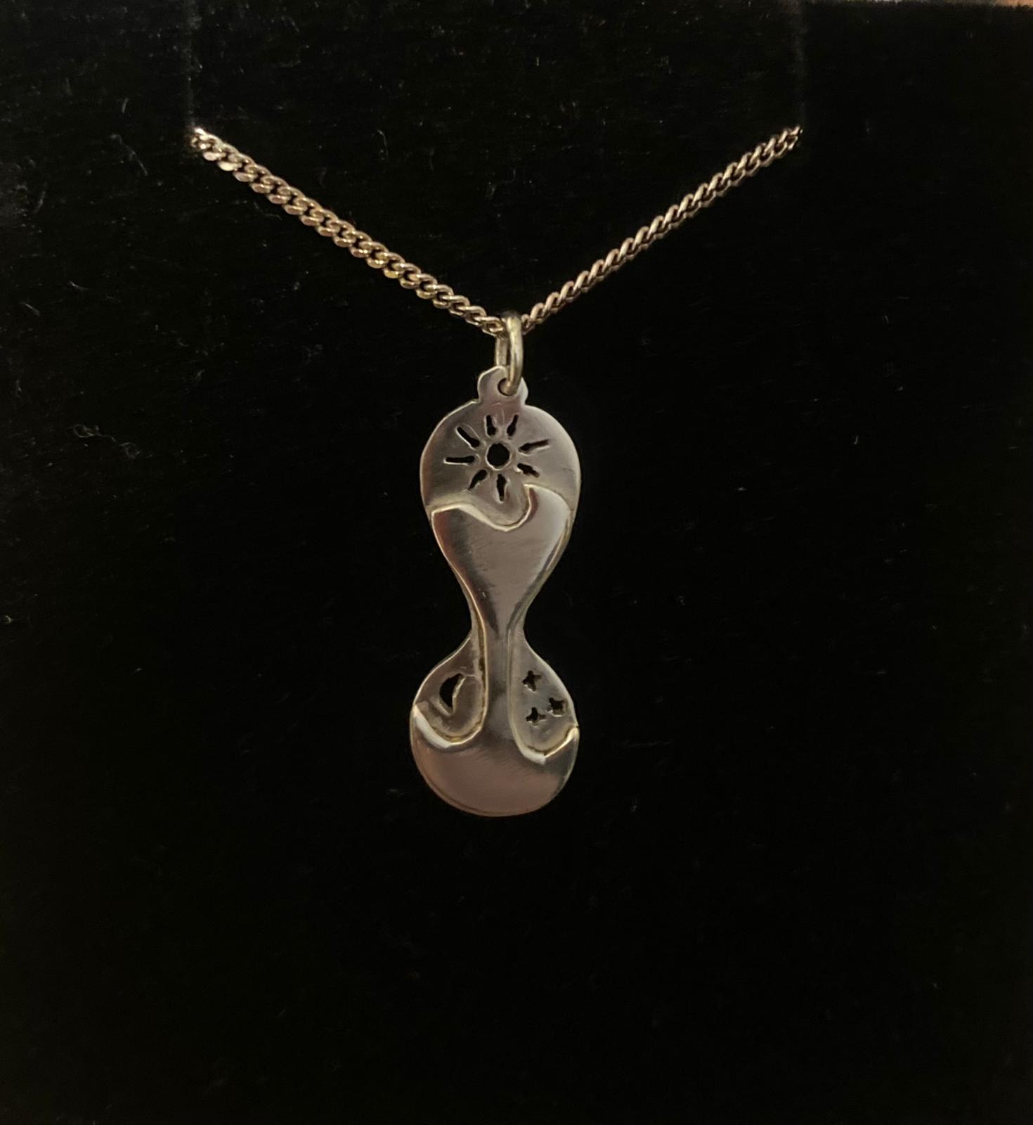 Silver hourglass pendant with silver chain