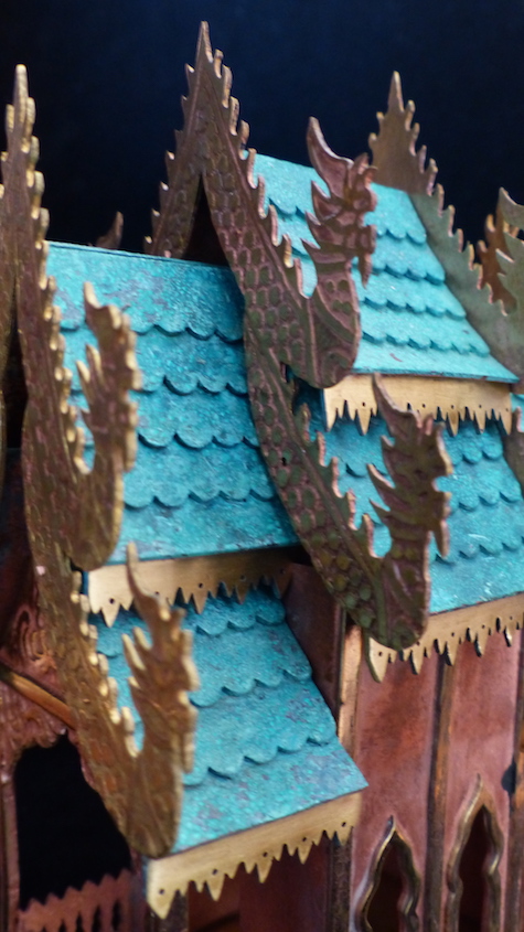 Pink guilded copper,brass and patinated green copper Spirit House roof close-up