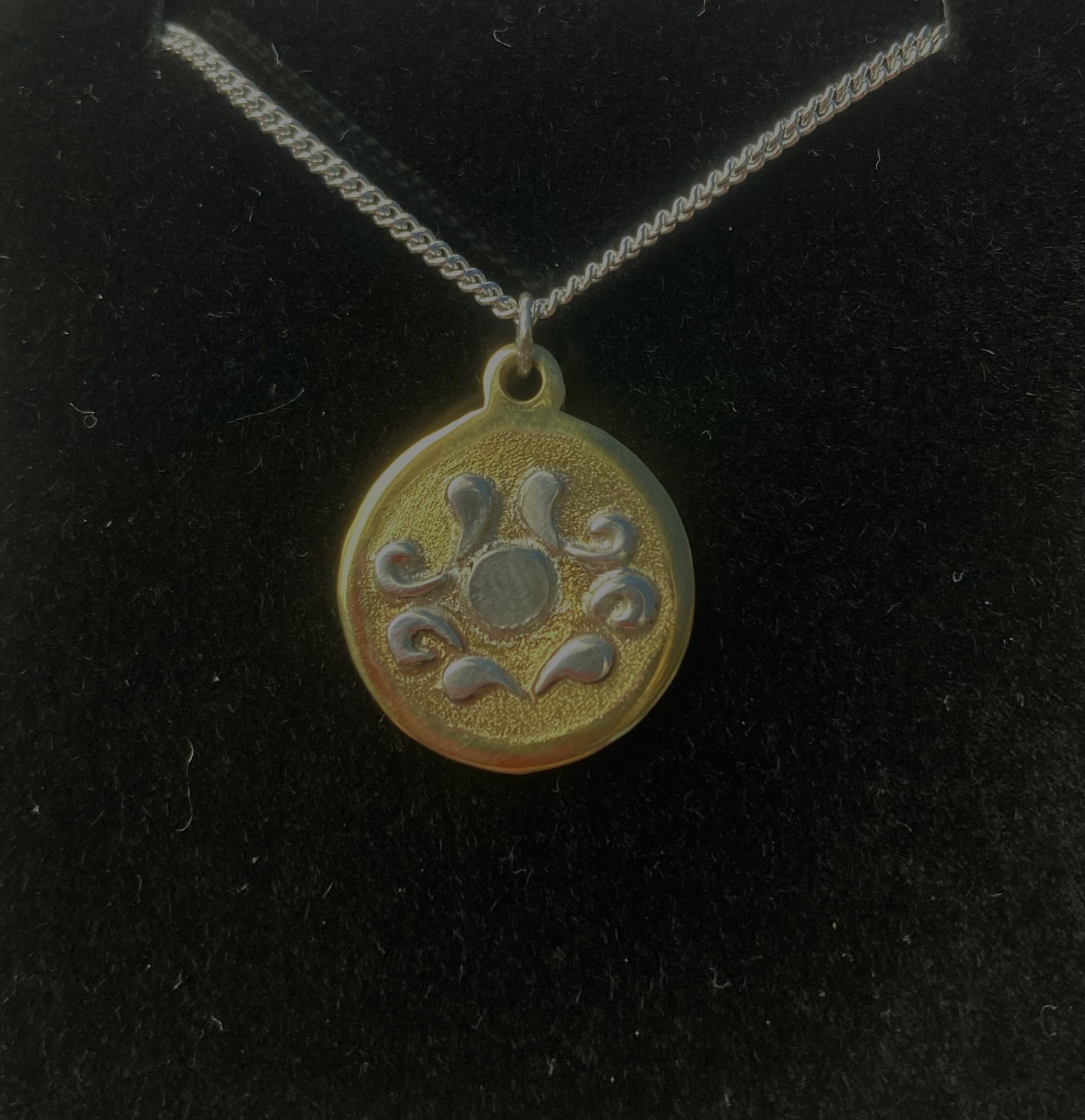 Unique brass pendant with silver chain