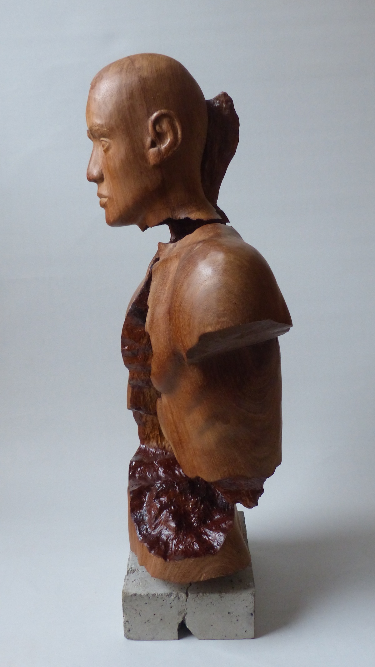 Teak hardwood sculpture of male left side