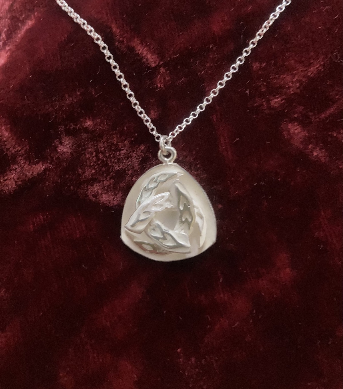 Triskelion celtic design with silver chain front side