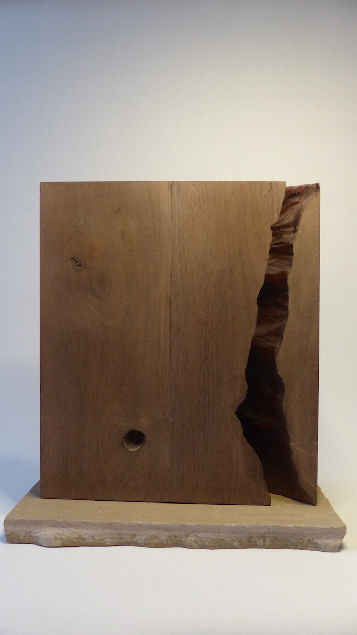 Cracked walnut block filled with brass cells reverse side