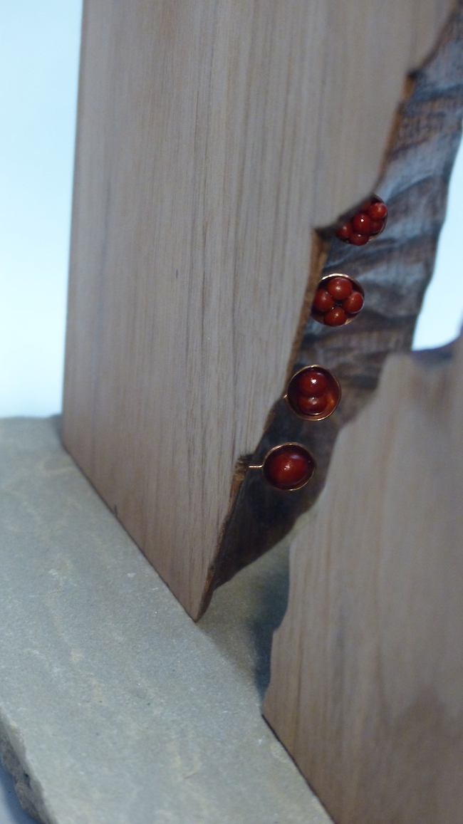 Cracked walnut block filled with brass cells cracked seam close-up