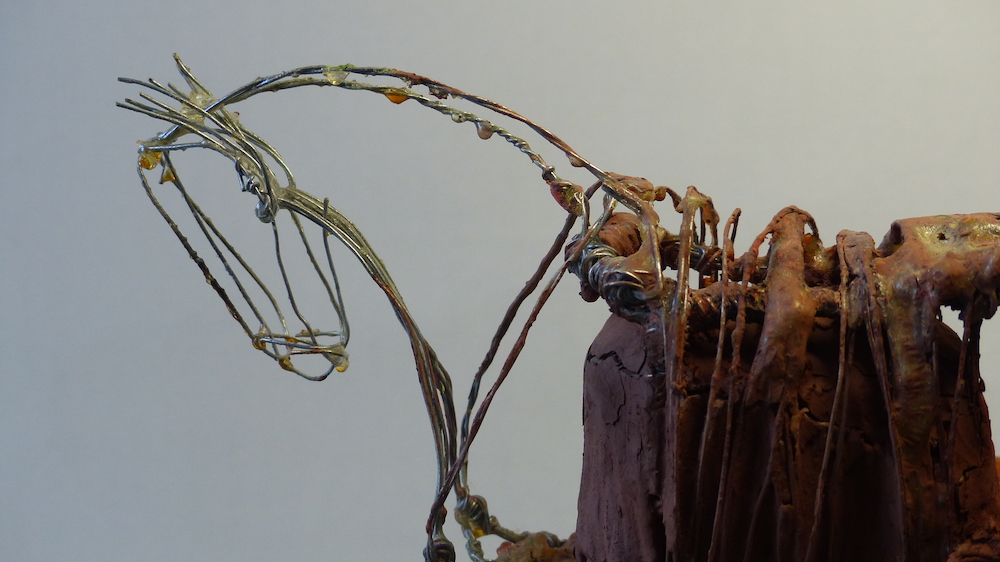 Wire horses - pair of opposites clay head close-up