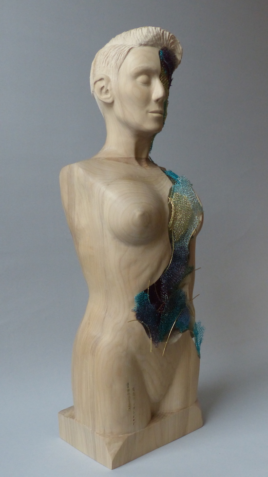 Cream hardwood female sculpture with colourful crochet layers right front side