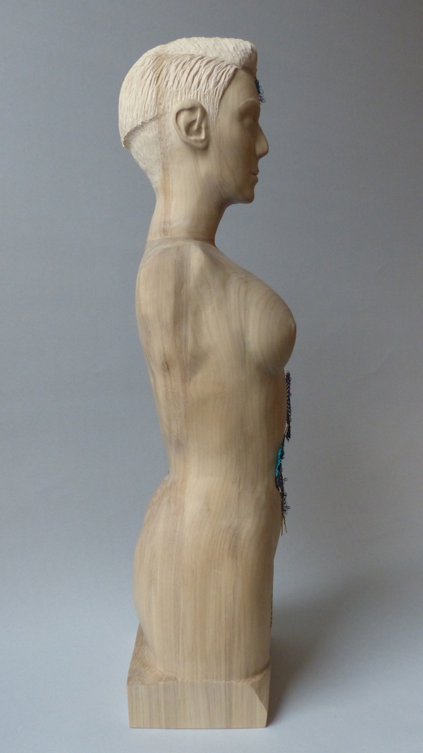 Cream hardwood female sculpture with colourful crochet layers right side