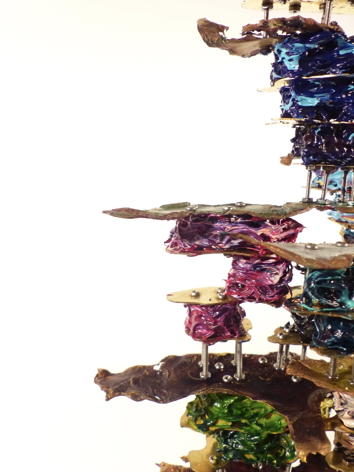 Cracked walnut block filled with brass cells front side angle